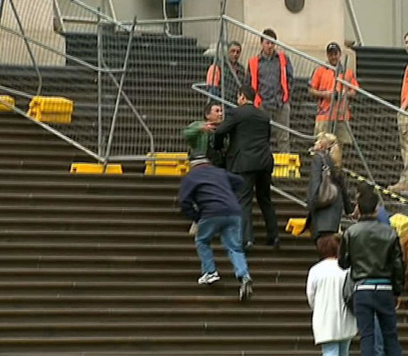 Geoff Shaw in confrontation with protestor on steps of Parliament House. 15 October 2013