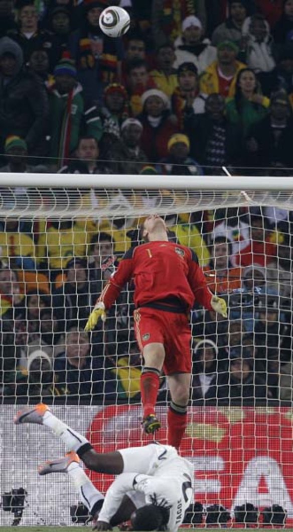Germany goalkeeper Manuel Neuer watches the ball go over the bar. 