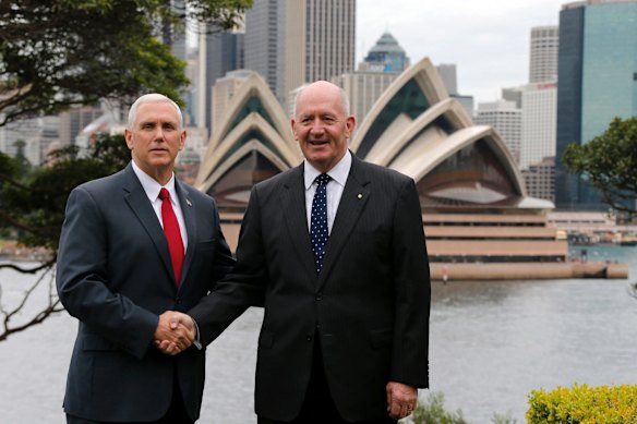 U.S. Vice President Mike Pence, shakes hands with Australia's Governor-General Peter Cosgrove at Admiralty House in Sydney.