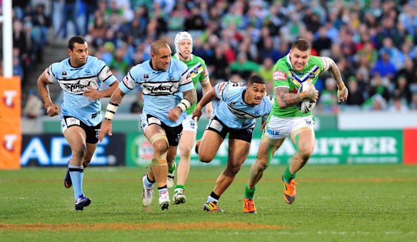 Josh Dugan busts the Sharks' line.