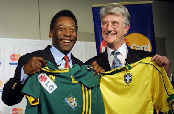 Pele on left, swaps a Brazilian jersey for an Aussie one with Soccer Australia's chief executive David Woolley, 2001.