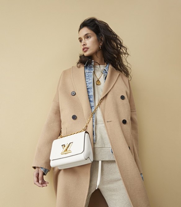 Zara coat, $259. Camilla and Marc “Gisella” jacket, $330, “Prosper” jumper, $199, and “Prosper” track pants, $199. Reliquia “Coralia” earrings, $139, and “Nugget of Wisdom” necklace, $179. Louis Vuitton “Twist” bag, $5050. 