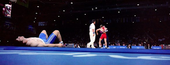 Juan Luis Maren of Cuba losing to Varteres Samourgachev of Russia in te 63kg wrestling gold medal match.