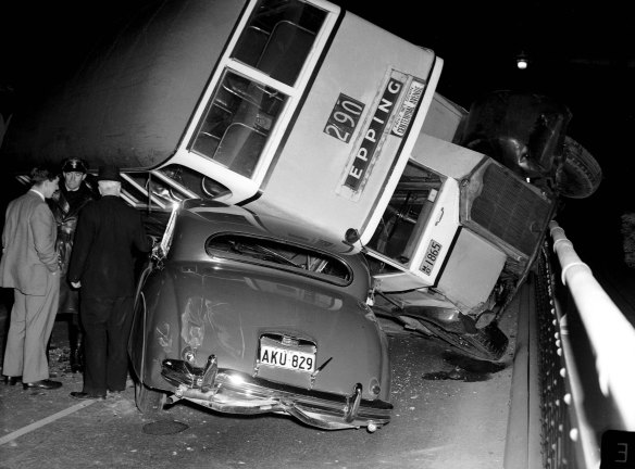 Bus overturns on a car on the Sydney Harbour Bridge, 7 August 1956.