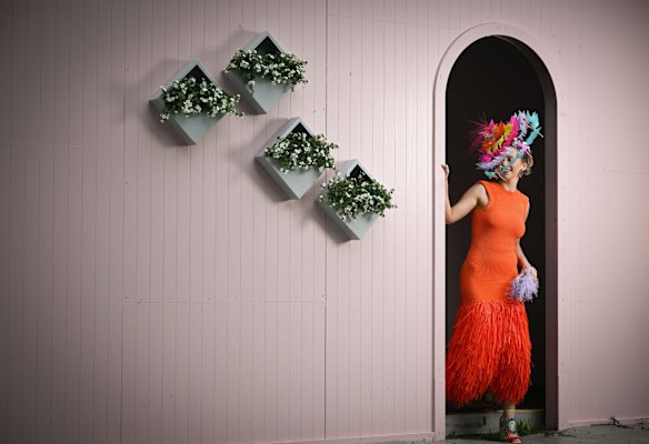2022 Melbourne Cup fashion at Flemington. Model Kiara Manning wears a head piece by Jettah and Till design, dress by Aje and shoes by Kat Maconie.