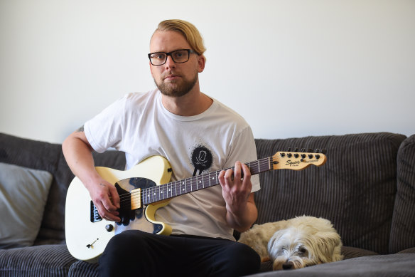 Daniel Whitehead with his dog Lemmy at home in Albury.