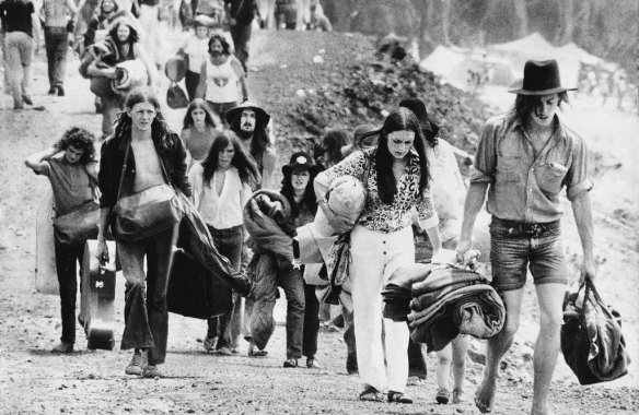 Sunbury Pop Festival.  Fans leave with their belongings at the end of the festival, February 1972