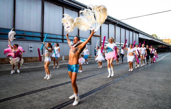 Participants in the Trans Pride Australia entry rehearse ahead of the Mardi Gras parade.