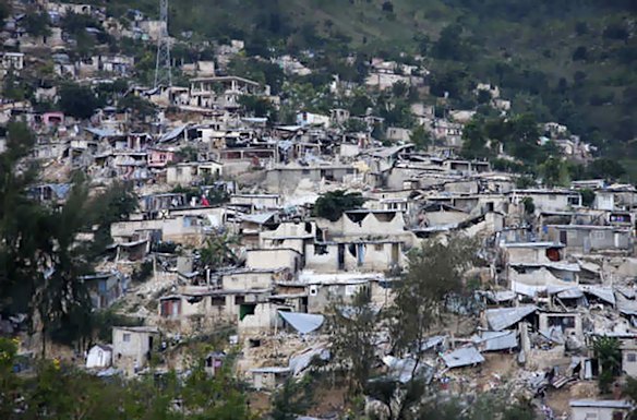 Scenes of chaos gripped the streets of the capital with people sobbing and wandering dazed amid the rubble of the impoverished city.