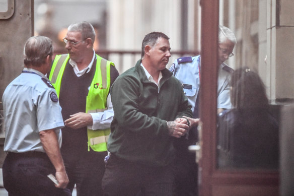 Karl Hague is taken into court before an earlier hearing.