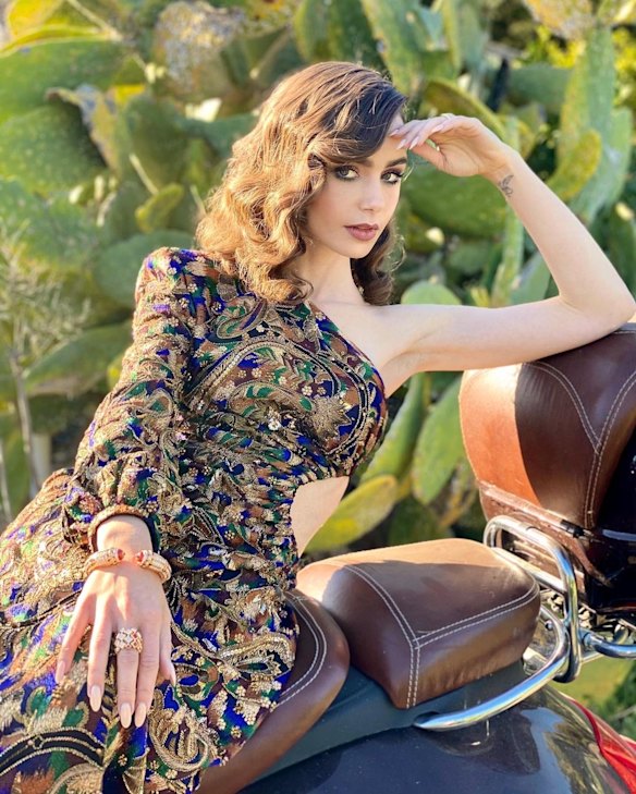 Lily Collins wears YSL and Cartier.