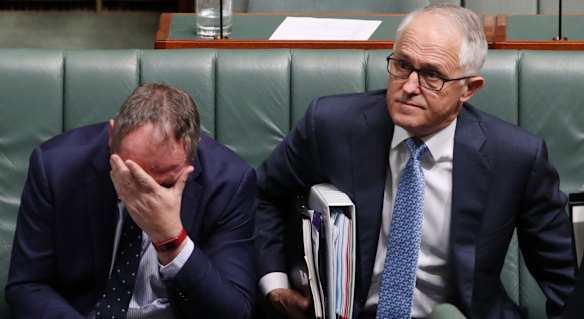 Deputy Prime Minister Barnaby Joyce and Prime Minister Malcolm Turnbull take a seat for a division during question time at Parliament House in Canberra on Wednesday 25 October 2017.