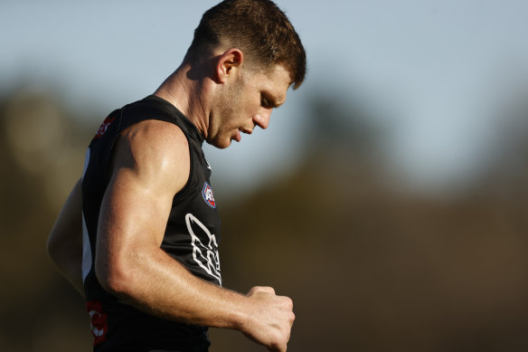 Heartbreak: A dejected Taylor Adams leaves training on Friday. He will miss the preliminary final because of injury.