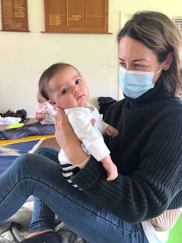 The writer with her baby, then 10 weeks’ old: “Sometimes, my daughter finds an old photo of me wearing a mask, and, being an inquisitive Miss Nearly-Five, has questions.”