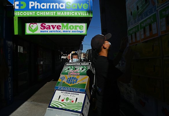Men deliver fresh fruit and vegetables to a grocer in Marrickville on Illawarra Road during the COVID-19 lockdown.