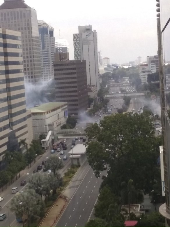 Smoke billows from an explosion in Jakarta, Indonesia, Thursday, Jan. 14, 2016. 