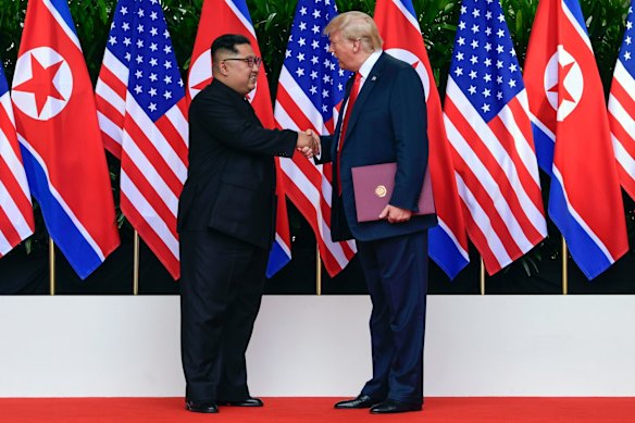 North Korea leader Kim Jong Un and U.S. President Donald Trump shake hands after their meetings at the Capella resort.