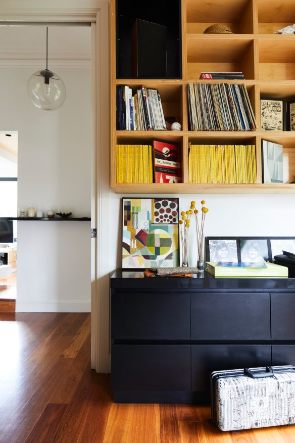 Great storage is a feature throughout. Here, the combined office and music room is lined with shelving and drawers. The vibrant abstract artwork is by Christine’s childhood friend, Eliza Burke.