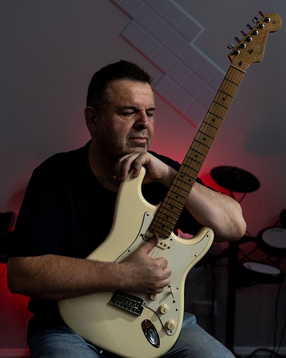 NDIS music therapist Juan Torres at his music studio in Sydney. 
