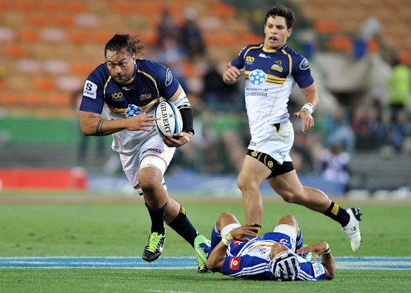 Fotu Auelua of the Brumbies charges over Gio Aplon of the Stormers.