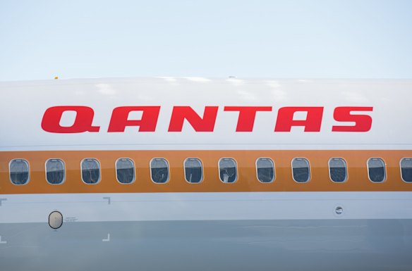 Time warp: Qantas' 75th Boeing 737-800 has been decked out in retro livery.
