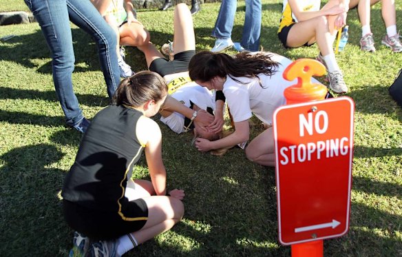 The Humpty Dumpty Foundation's Balmoral Burn run. Exhausted runners recover after the Girls 'Head of The Hill' relay.