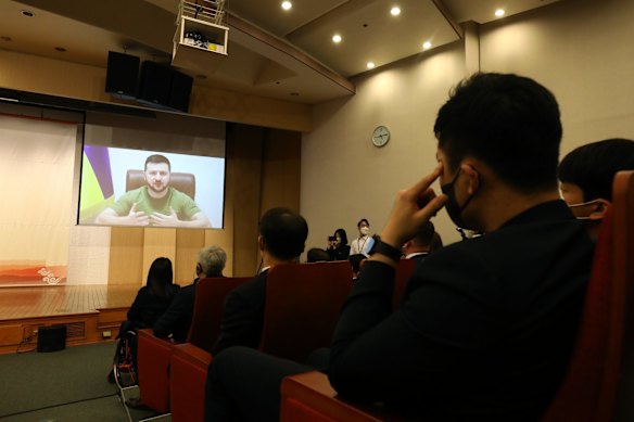 Ukrainian President Volodymyr Zelensky addresses the South Korean parliament via video link at the National Assembly in Seoul, South Korea. Zelensky has made a number of virtual appearances in recent weeks, lobbying foreign governments to help Ukraine defend against Russia's invasion.
