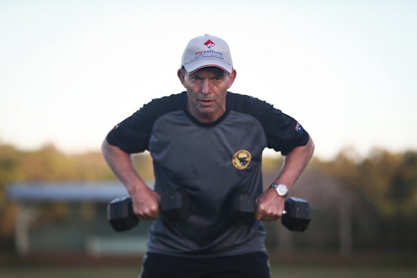 Prime Minister Tony Abbott doing physical training with members of the Bamaga community, during his visit to Cape York.