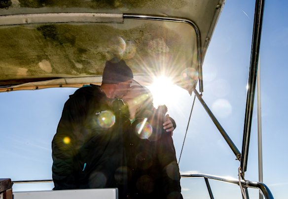 Girlfriend Kate Birrell wishes swimmer Grant Siedle luck with a kiss just before he gets into the water to swim across the rip, June 13, 2016. Photo: Justin McManus