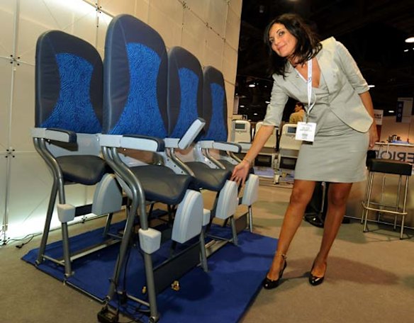 Jenny Carlino who is a regional manager for the Italian company Aviointeriors S.P.A, shows her firms new 'Skyrider' standing seat.