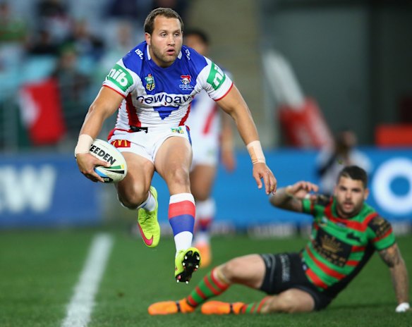 Hop, skip and a jump: Tyrone Roberts of the Knights runs the ball out of his in-goal.