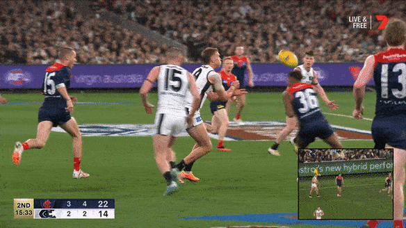 Melbourne’s Kysaiah Pickett delivers a high bump on Patrick Cripps.