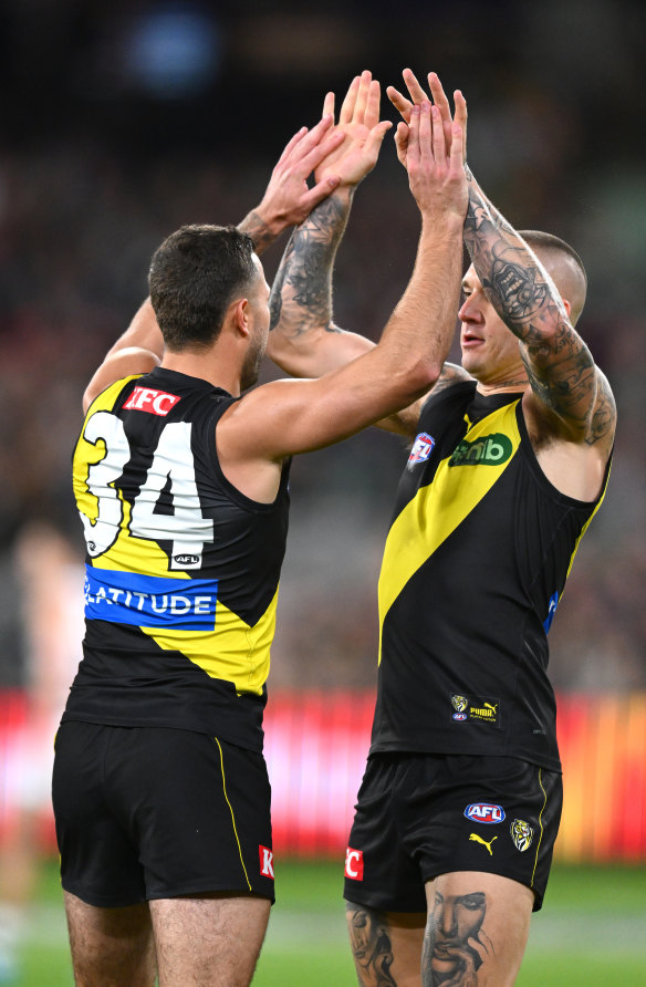 Jack Graham of the Tigers celebrates with Dustin Martin.