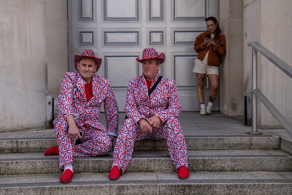 People wearing Union Jack outfits enjoy the Platinum Jubilee in London.