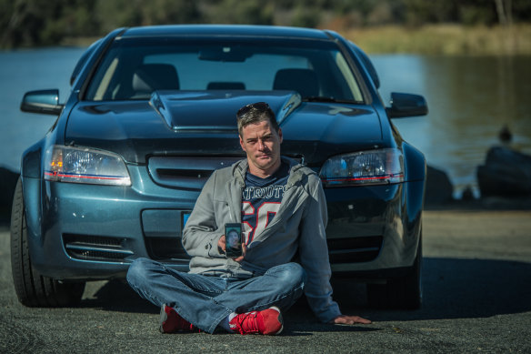 Justin Hogg in front of his prized Holden Commodore, which he is taking on a car cruise he has organised for Saturday in memory of his brother Adrian, who died in a motorbike crash.