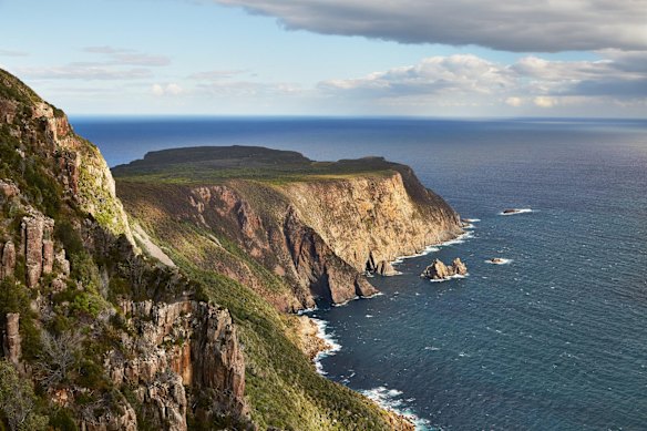 CAPE RAOUL: In a sense, Cape Raoul is the Tasman Peninsula's forgotten cape. Intended as the third cape on the Three Capes Track, it now sits blissfully removed from the multiday walk, but a recent track upgrade has smoothed the way for day walkers. From the trailhead just south of Port Arthur, the walk rises to a high cliff edge - left from here lies Cape Raoul and right leads down to the surfing sensation of Shipstern Bluff. The track to the cape tapers down beside the dwindling cliffs to arrive at the Tasman Peninsula's southernmost point, looking down onto a narrow and dramatic spine of dolerite towers stepping down into the Southern Ocean.