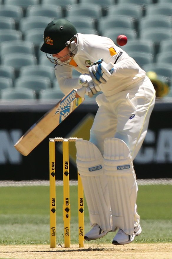 Michael Clarke ducks a bouncer off his his bowl faced off Varun Aaron.