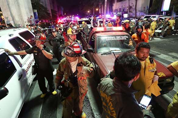 Emergency vehicles and members of the Fire Department arrive to assist following an explosion at the Ratchaprasong intersection in Bangkok, Thailand, on Monday, Aug. 17, 2015.