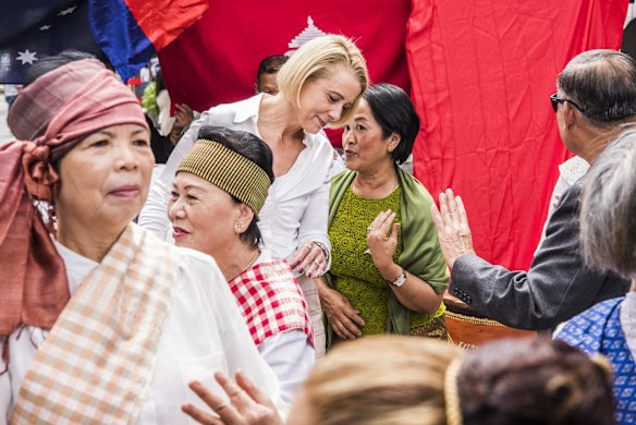 Federal Labor frontbencher Kirstina Keneally dancing with members of the Cambodian community in Cabramatta.