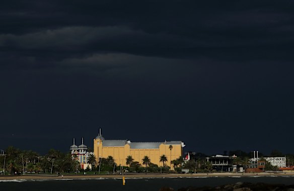 Palais Theatre and Luna Park St Kilda shine under a heavy sky in April.