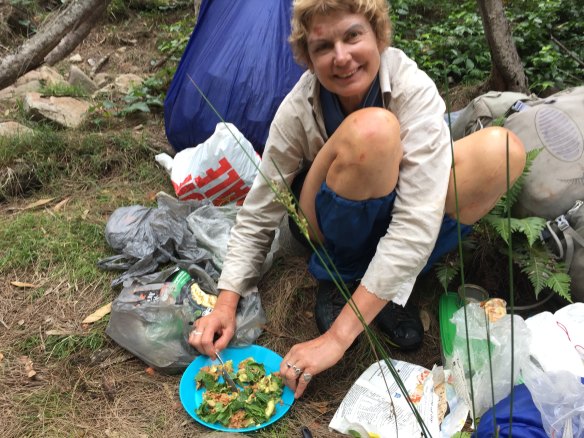 Francisca Boterhoven De Haan has a meal at a campsite she and William McCarthy set up during their six nights in Morton National Park.