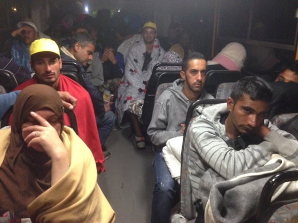 Migrants board buses said to be bound for Austria outside Keleti station in central Budapest, Hungary.