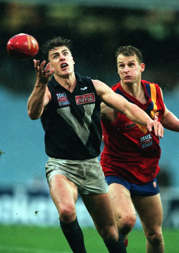 Pride of the jumper: Matthew Lloyd juggles a mark in 1999.