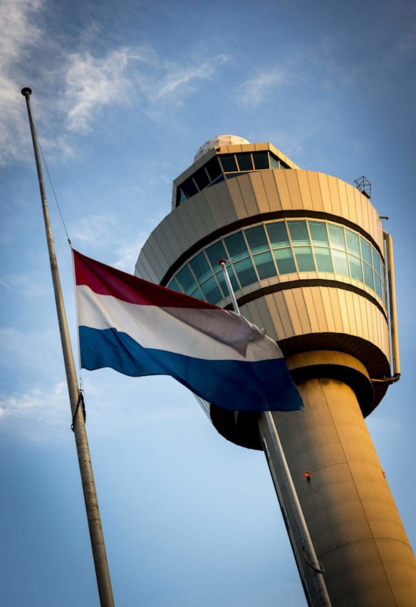 A Dutch flag is flown at half-mast at the Schiphol Airport near Amsterdam, on July 18, 2014, a day after the Malaysia Airlines flight MH17 crash in east Ukraine. Interpol on Friday said it will send a team in the next 48 hours to help identify victims killed in the crash.  the crash in Eastern Ukraine of Malaysian Airlines flight MH017 during a flight from Amsterdam to Kuala Lumpur, with 298 people onboard.  The Netherlands has dispatched Foreign Minister Frans Timmermans and a team of forensic experts to Ukraine to probe the disaster, in which 189 Dutch citizens died.