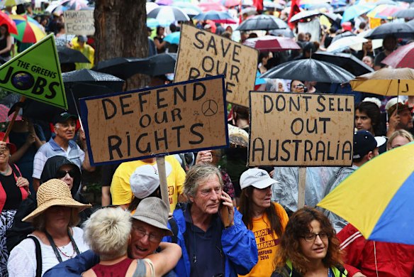 SYDNEY, AUSTRALIA - MARCH 16:  Protesters demonstrate against the Abbott led Coalition Government on March 16, 2014 in Sydney, Australia. March In March is a nationwide grassroots protest organized to deliver a statement of no confidence in the current Australian Government.  (Photo by Don Arnold/Getty Images)