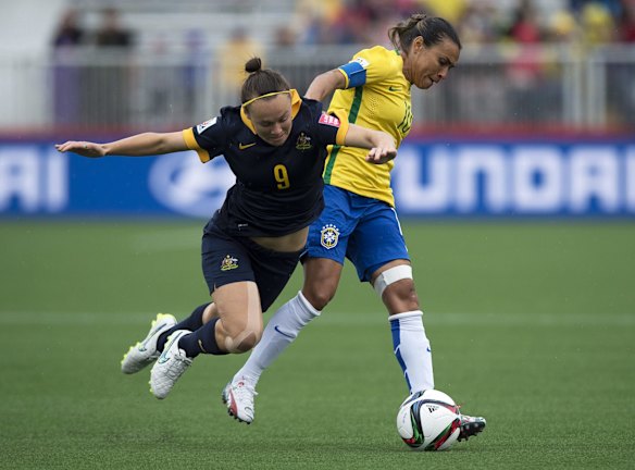 Australia's Caitlin Foord, left, and Brazil's Marta battle for the ball.