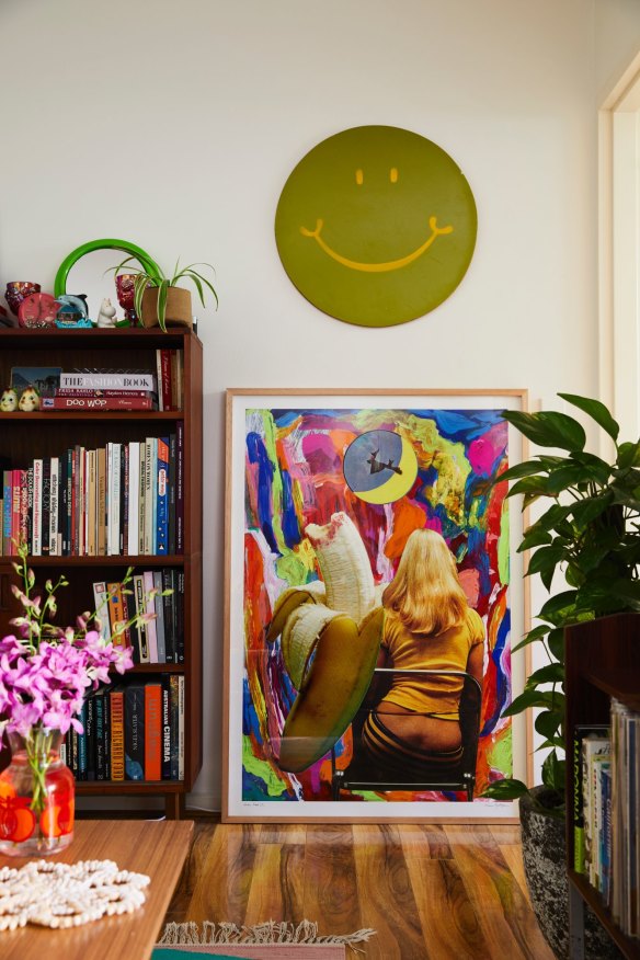 The green smiley face is a 1970s skim board from a vintage store and hangs above one of Minna’s collages. “It works as a positive, affirming influence.” 