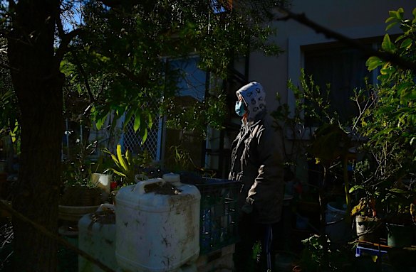 Victor Jauco, 86yrs, in his garden at his home in Marrickville during the COVID-19 lockdown. Originally from the Philippines, Victor lives alone after his wife died in January this year. Now retired he spends his time gardening.