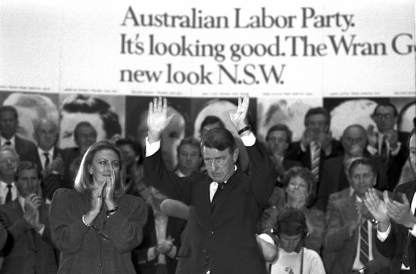 Neville Wran acknowledges the crowd as he announces his resignation, which will take effect on 4 July 1986, with his wife Jill (left) by his side at the Town Hall during the Labor Party (ALP) Conference, June 7, 1986.