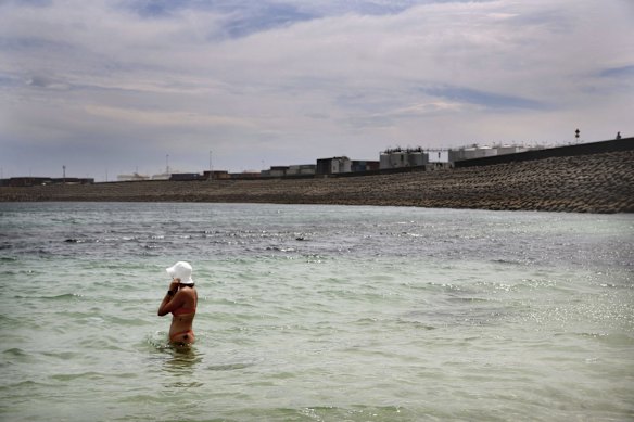 Crowds find refuge from the oppressive heat, swimming at Yarra Bay.